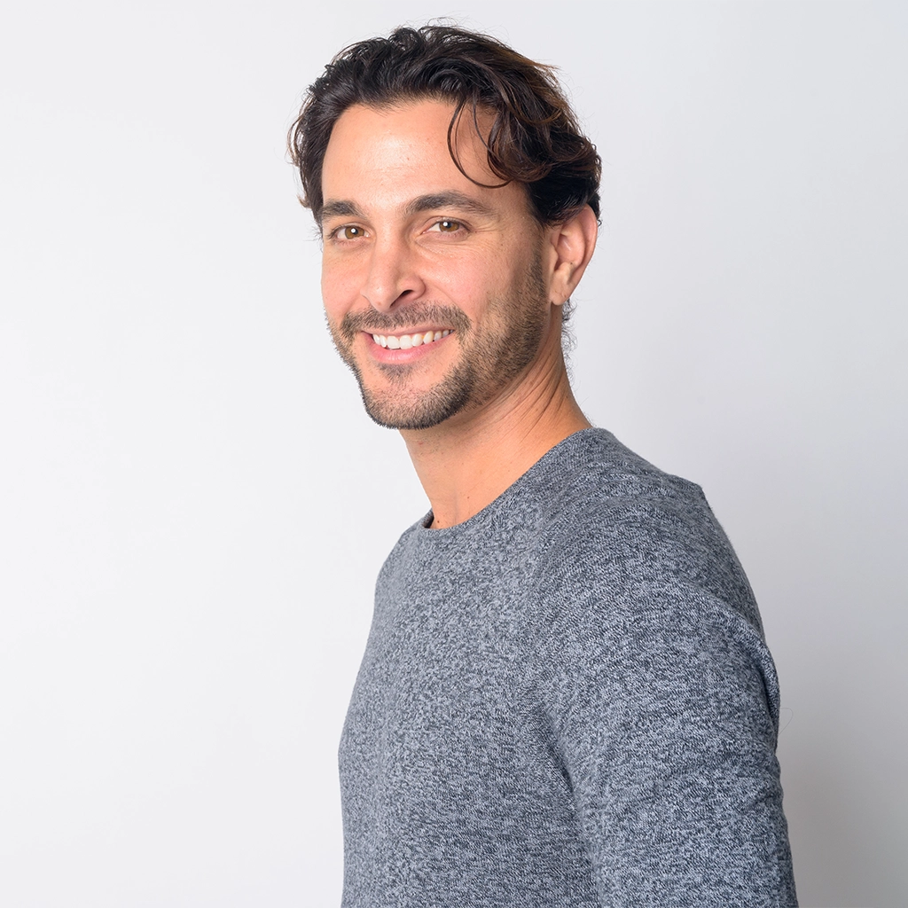 closeup profile view of happy hispanic man smiling