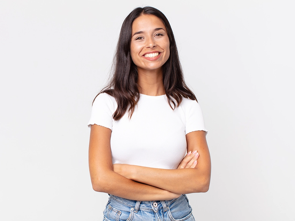 pretty hispanic woman looking happy proud and smiling